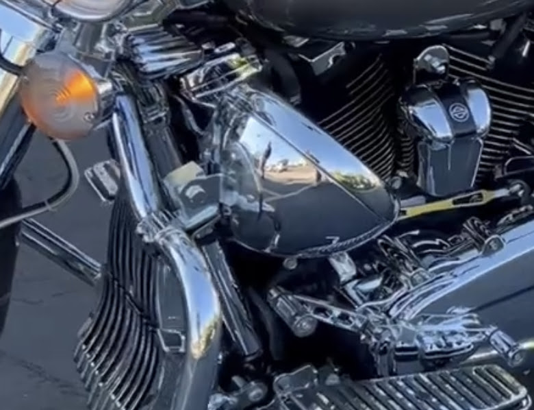 Chrome teardrop air cleaner and Harley-Davidson badge on a bagger engine